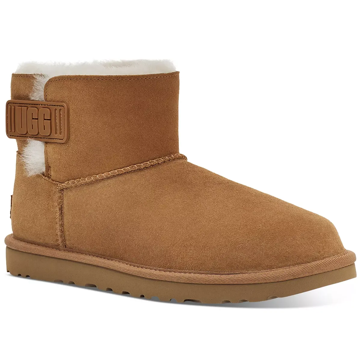 Tan short boot with a plush white lining and a branded logo on the side.