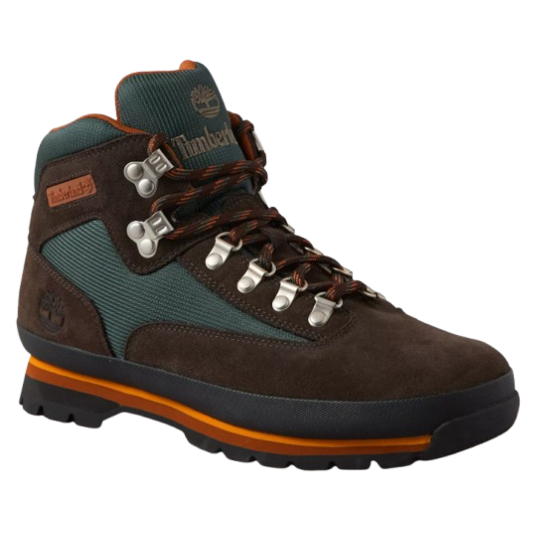 Brown and green hiking boot with orange accents, featuring metal eyelets and a durable sole.