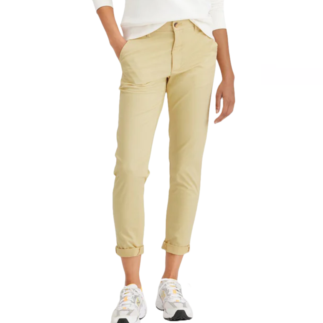 Dockers Weekend Chinos are beige, slim-fit pants with rolled cuffs, featuring a classic button and zipper closure, side pockets, and a casual, comfortable style, paired with white sneakers.