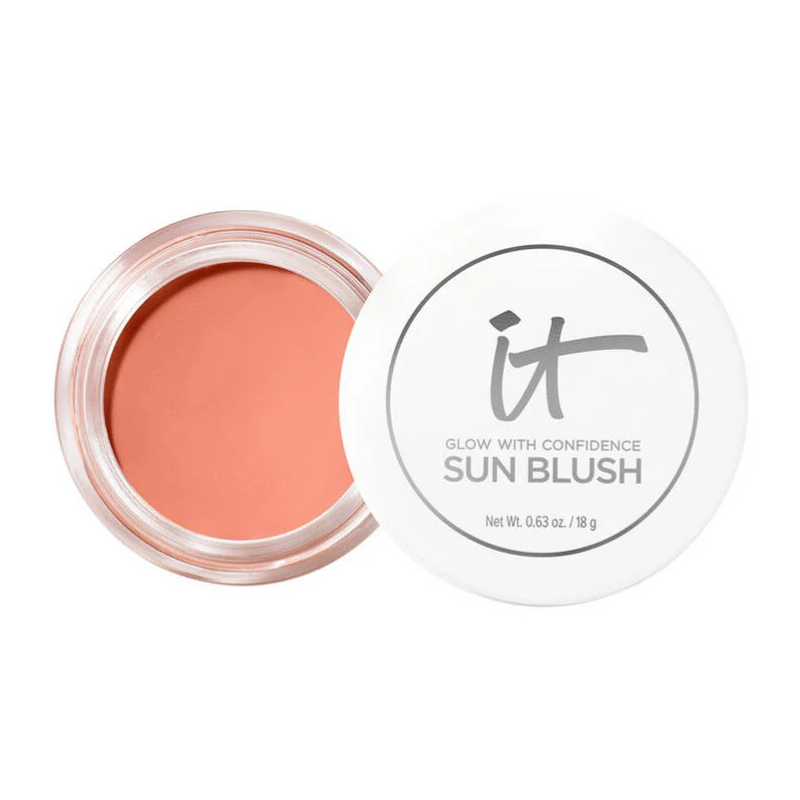 IT Cosmetics Sun Blush is a cream blush with a warm, peachy-pink shade, designed to give a natural glow. The packaging includes a white lid with the brand's logo and product weight of 0.63 oz / 18 g.
