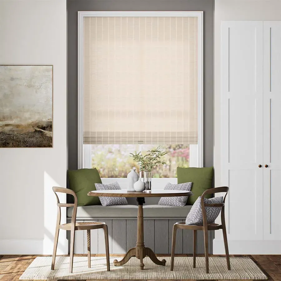Escape Woven Wood Shades are light-filtering window treatments in a neutral beige color with a subtle vertical pattern, providing a natural and elegant look to a room.