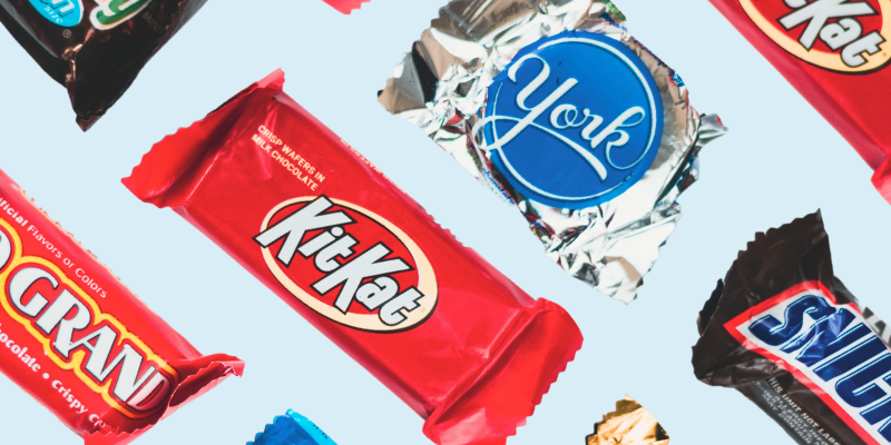 candy bars on light blue background