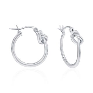 A pair of silver knot hoop earrings with a polished finish.