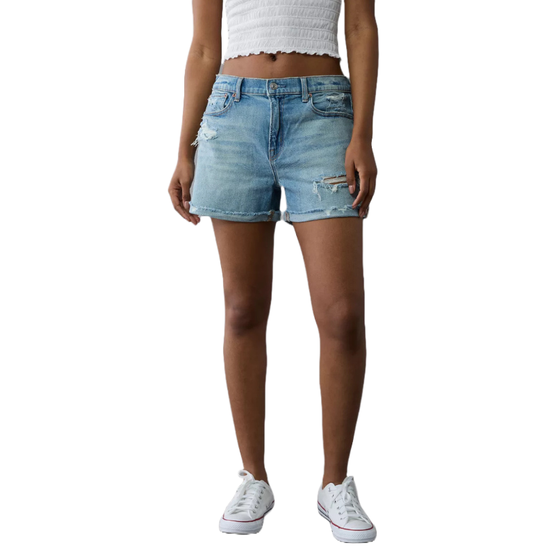 AE Ex-Boyfriend Denim Shorts feature a light wash with a relaxed fit, distressed details, and raw hems, styled with a white cropped top and white sneakers.