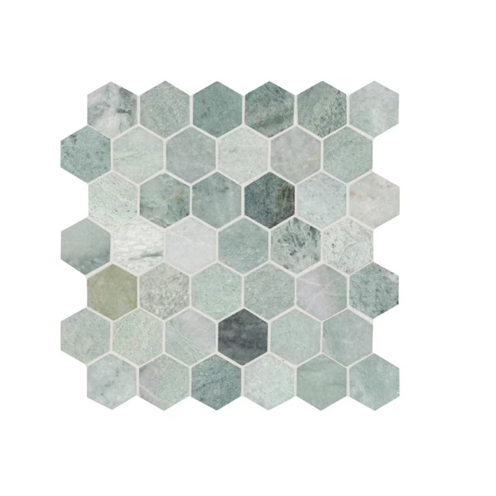 MSI Icelandic Green Hexagon Mosaic Tile features a mix of light green and subtle gray hexagonal stones, creating a natural and calming pattern.