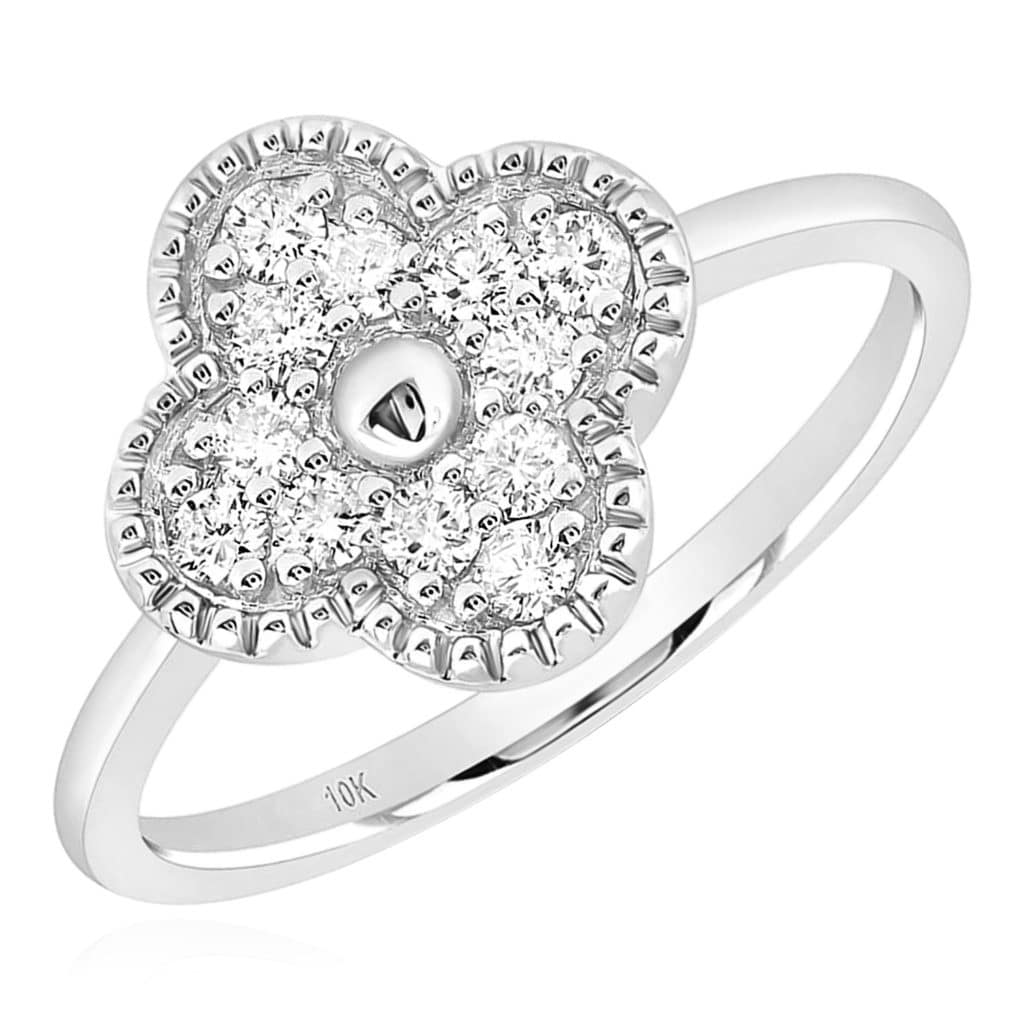 A white gold ring featuring a clover-shaped motif adorned with small diamonds, hallmarked with \“10K\“ indicating its gold purity.