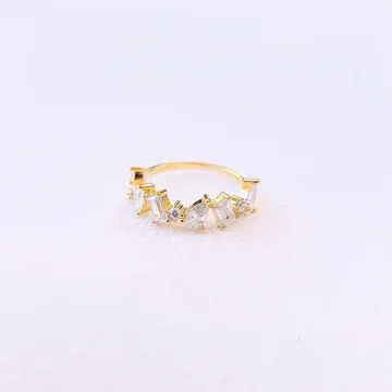 A gold ring with multiple diamond settings on a white background.