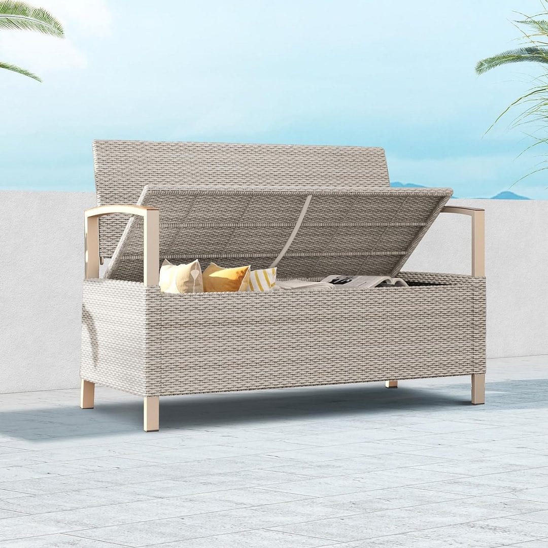 Outdoor wicker sofa with adjustable backrest and wooden armrests, featuring beige cushions and yellow accent pillows.