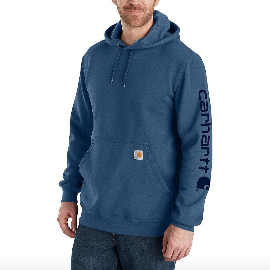 Blue Carhartt hoodie with front pocket and drawstring hood, featuring \“Carhartt\“ text on the sleeve.
