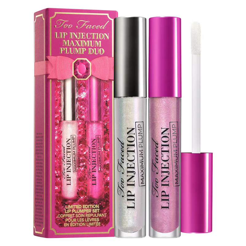 Too Faced Lip Injection Maximum Plump Duo includes two lip plumpers in iridescent and pink shades, packaged in a pink box with a decorative bow design.