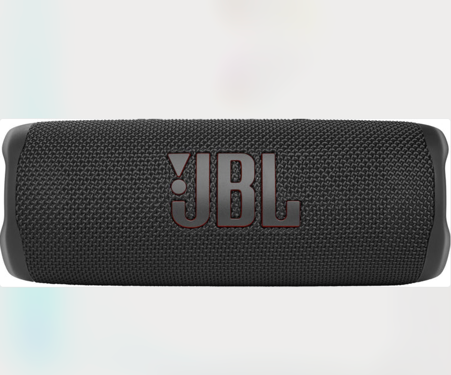 A black JBL branded portable Bluetooth speaker with a textured exterior.