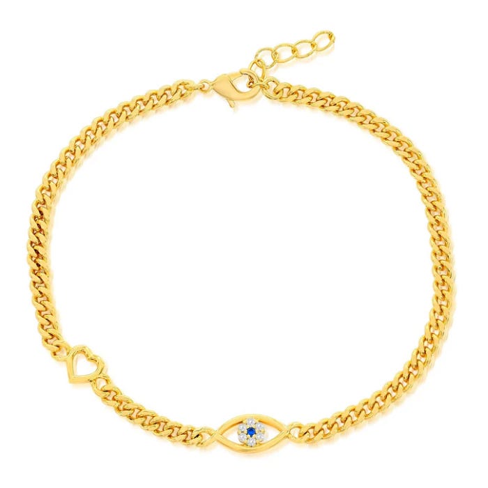 Gold chain bracelet with a heart detail and an eye-shaped charm featuring a small blue gemstone.