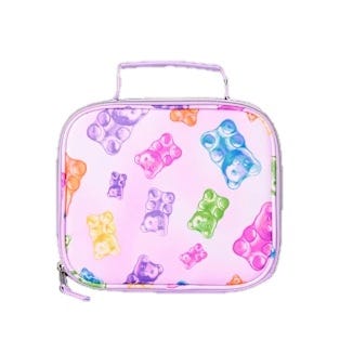 A lunch box with colorful gummy bear designs on a light pink background, featuring a handle and zipper closure.