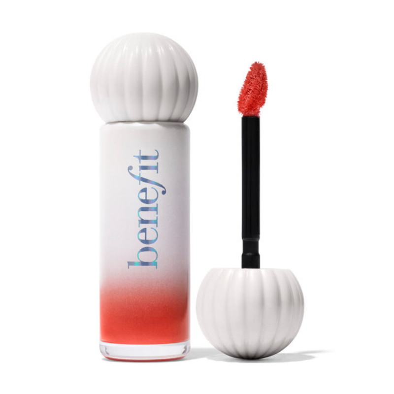 Benefit Cosmetics Splashtint features a cylindrical white bottle with a gradient red tint, paired with a textured applicator cap and a red brush applicator.