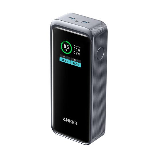 This is an Anker power bank with a 12,000mAh capacity, featuring a digital display showing battery percentage and output stats, with a textured, metallic body.
