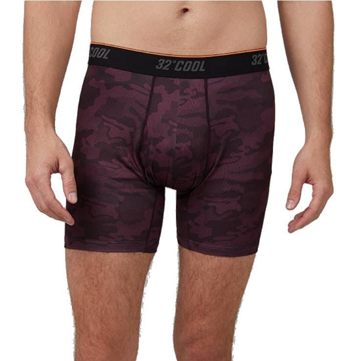 32 Degrees Cool Boxer Briefs feature a purple camouflage pattern with a black waistband labeled \“32° COOL.\“ They have a snug fit and reach mid-thigh.