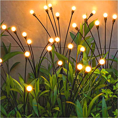 Solar Firefly Lights consist of multiple warm LED lights attached to bendable wires, designed to emulate the look of fireflies among greenery.