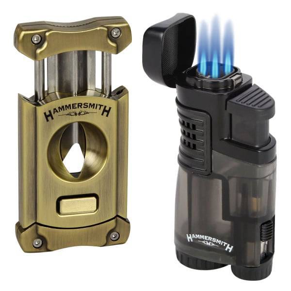 A brass cigar cutter and a black triple-flame torch lighter, both branded Hammersmith.