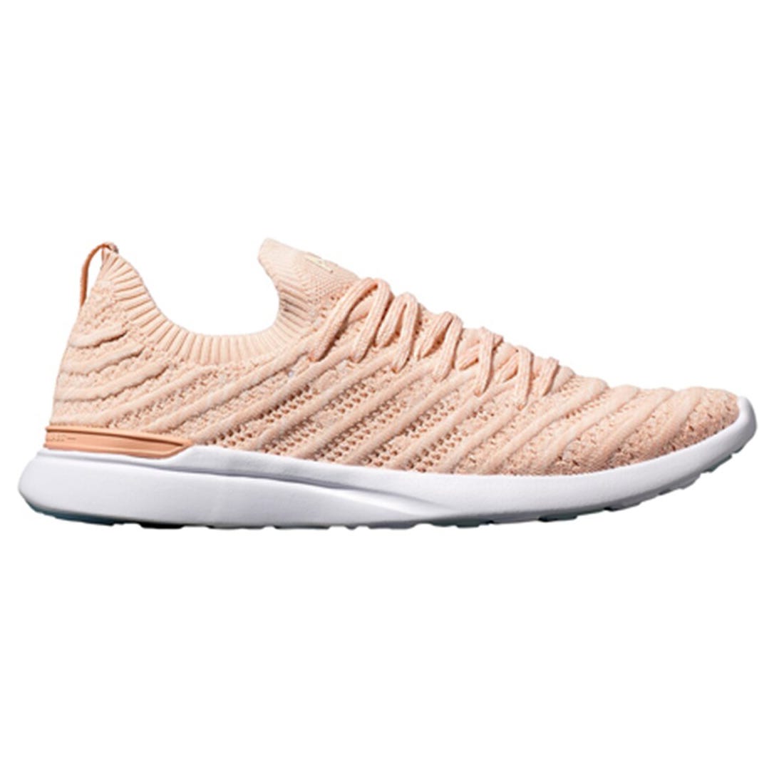 A single peach-colored knitted athletic shoe with a white sole.