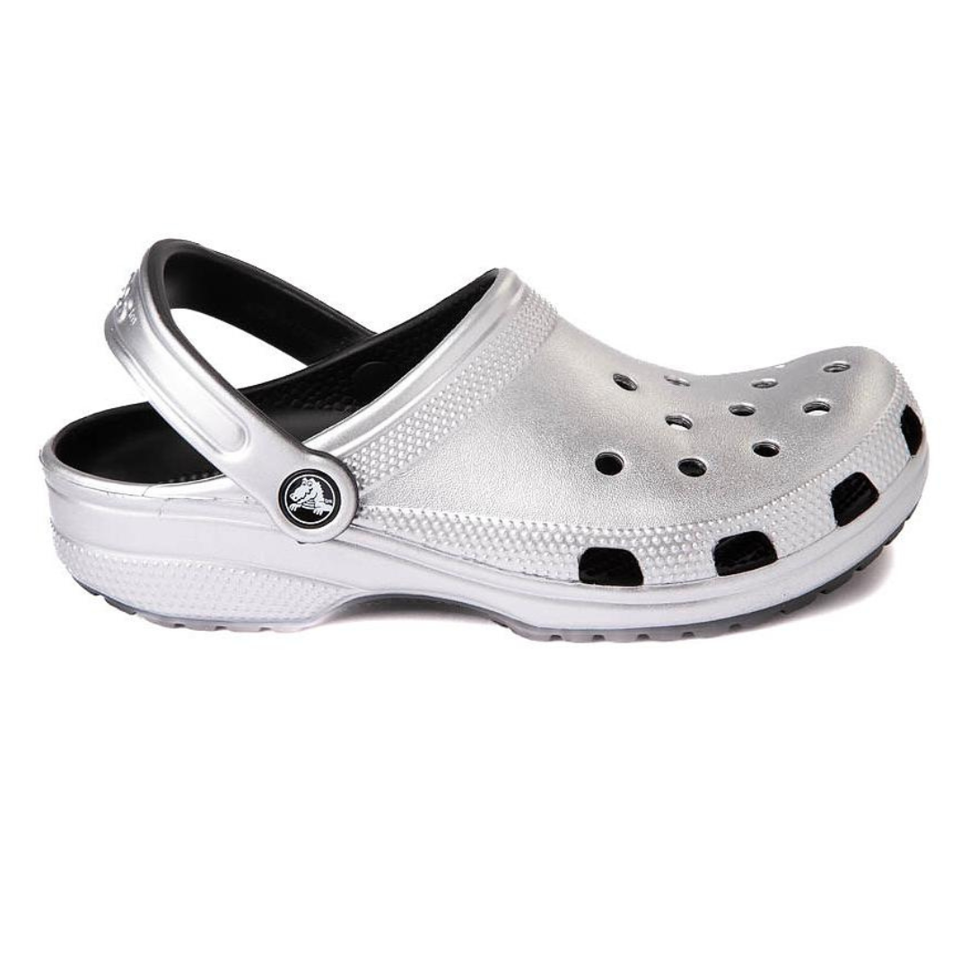 A single silver-colored clog with ventilation holes and an adjustable heel strap.