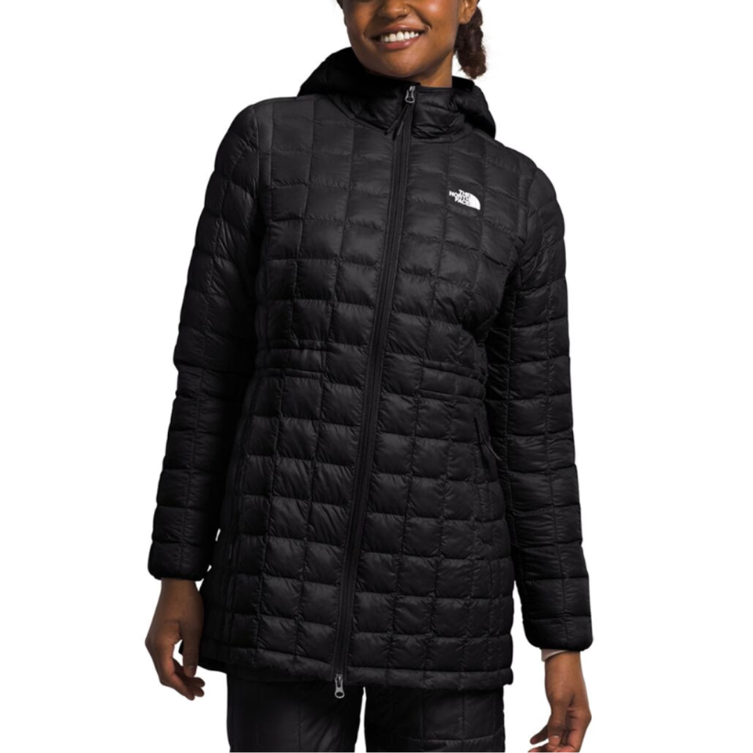 The North Face ThermoBall Parka is a black, hooded, quilted parka with a front zipper and the brand logo on the chest. It's designed for warmth and lightweight comfort.