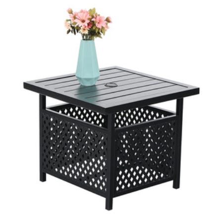 A square outdoor metal patio table with a lattice design base and a blue vase holding pink flowers on top.