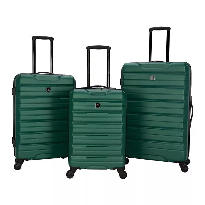 A set of three green hardshell rolling suitcases in different sizes.