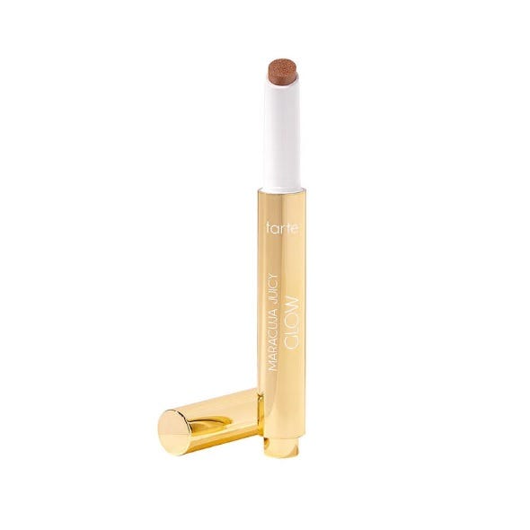 Tarte Maracuja Juicy Glow, a twist-up cosmetic stick in a gold tube, designed for adding a radiant glow.