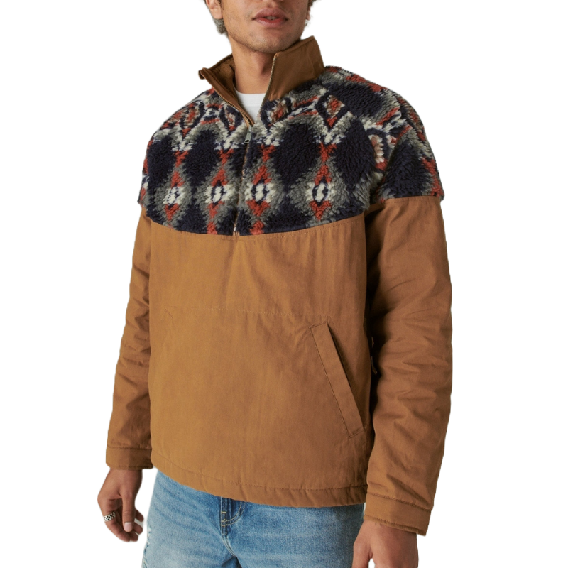 A casual, brown Lucky Brand jacket featuring a faux shearling upper with a geometric pattern in navy, red, and gray, designed with a half-zip front and side pockets, paired with light blue jeans.