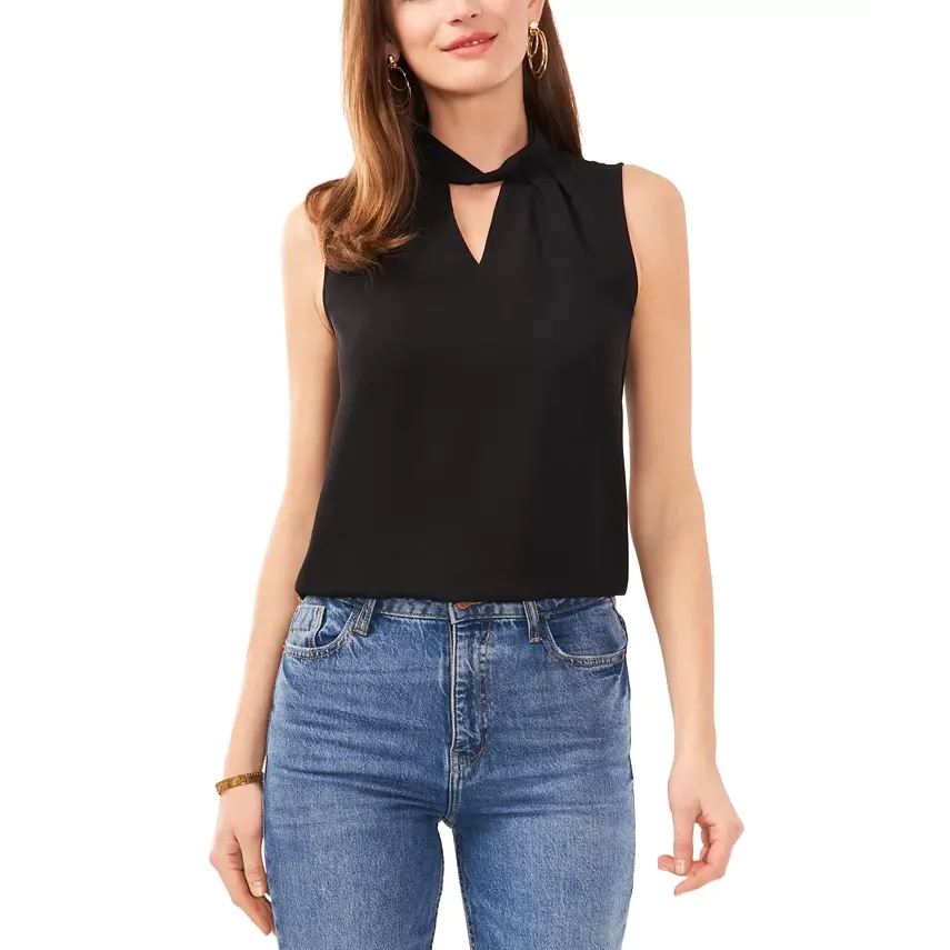 Black sleeveless top with a necktie, paired with blue jeans.