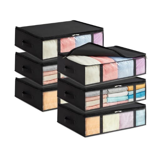 Stackable fabric storage boxes with see-through windows, filled with clothes and linens.