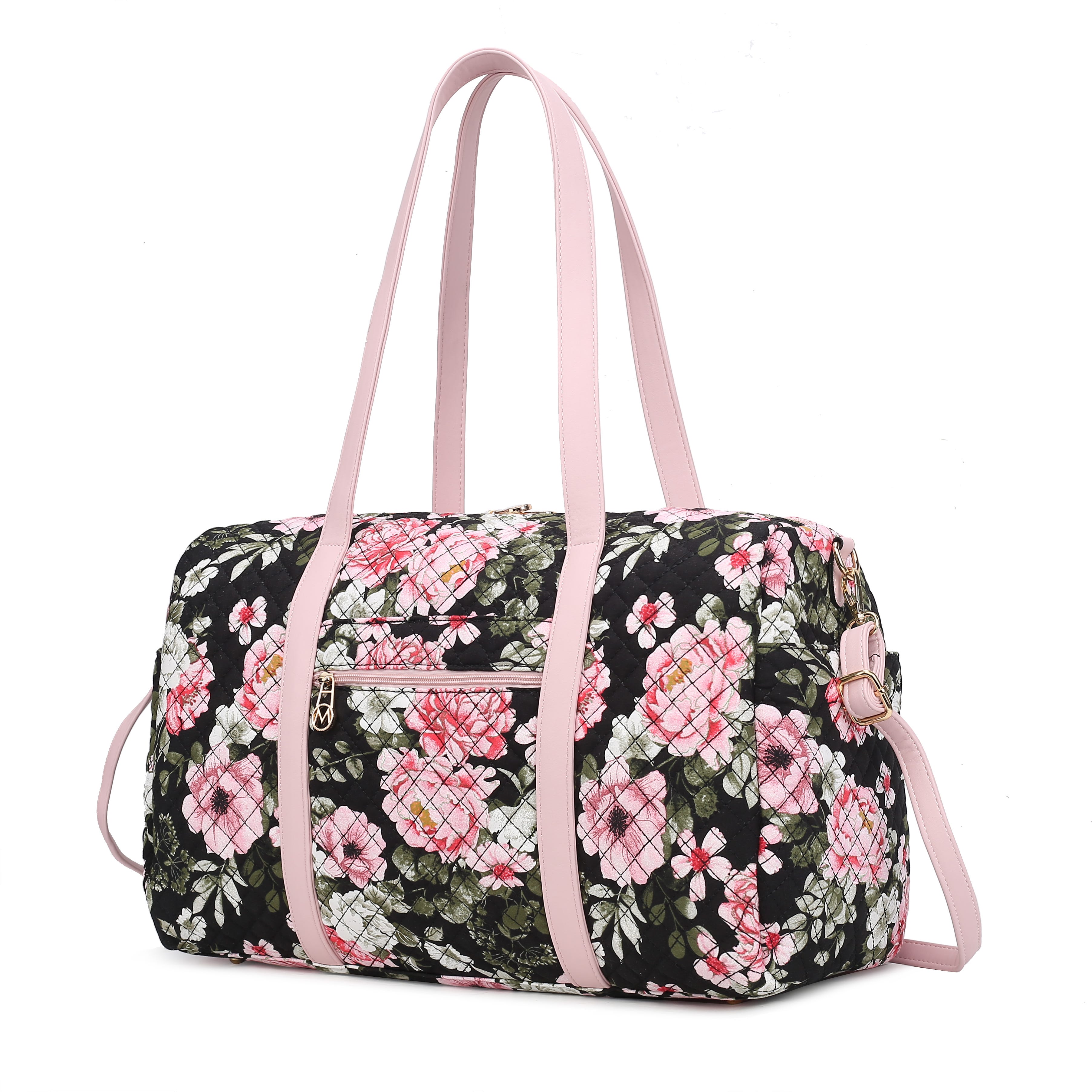 A quilted floral-patterned duffel bag with pink handles and a detachable shoulder strap, featuring a front zippered pocket.