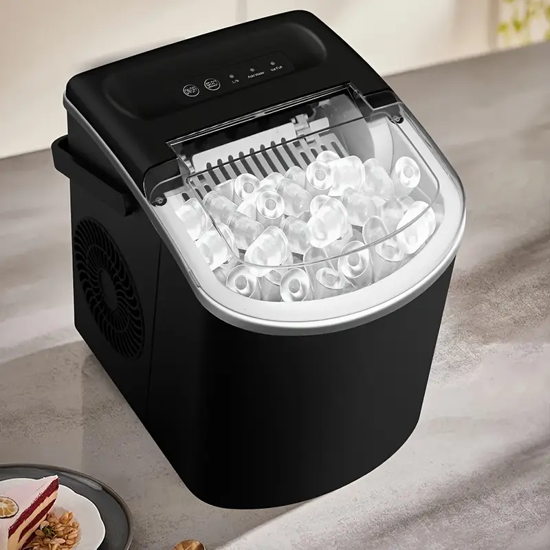A black countertop ice maker with a transparent lid, showing bullet-shaped ice cubes inside. It features an easy-to-use control panel on top and a side fan for cooling.