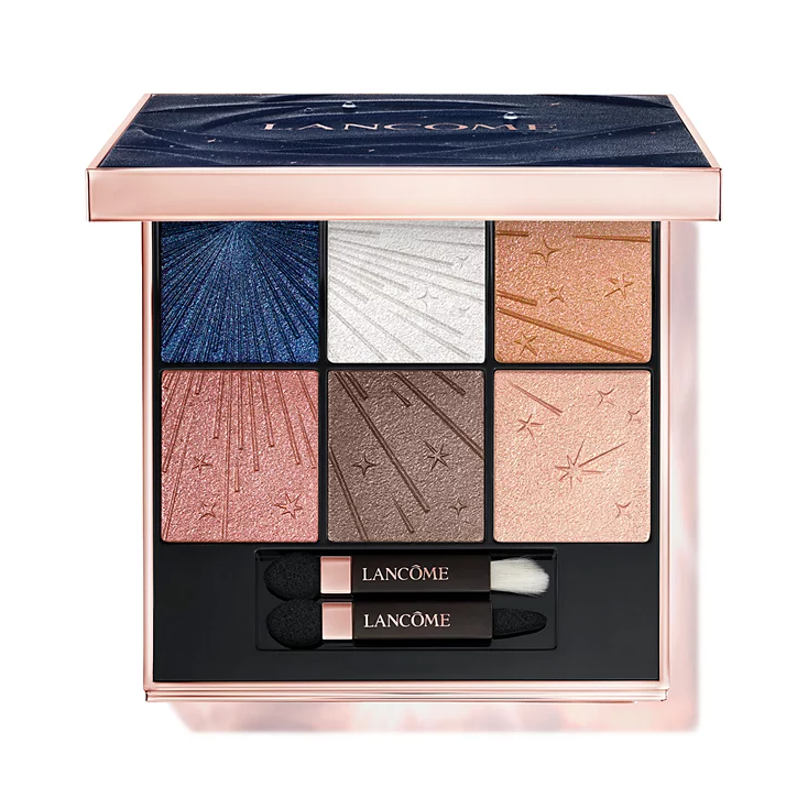 Lancôme eyeshadow palette featuring nine shades in a variety of colors, including blue, white, gold, pink, and brown, each with starry and textured patterns. Includes two applicators.