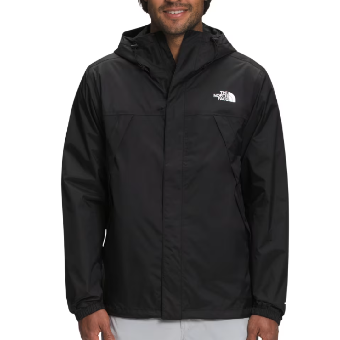 The North Face Men's Antora Jacket is a black hooded rain jacket featuring a front zip, elastic cuffs, and the brand's logo on the chest. It's designed for weather resistance and offers a sleek, functional style.