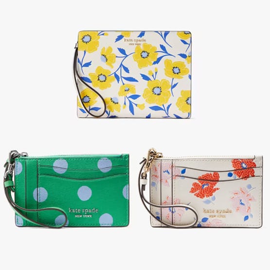 Three Kate Spade wallets with floral and polka dot designs; one with a wrist strap.