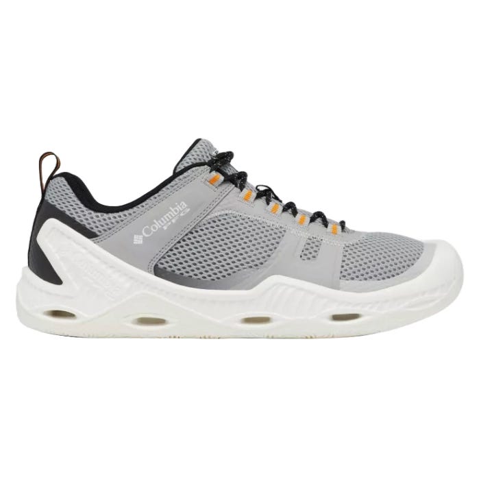 A gray and white Columbia athletic shoe featuring a mesh upper, black and orange accents, and a white sole with visible drainage ports, designed for outdoor and water activities.