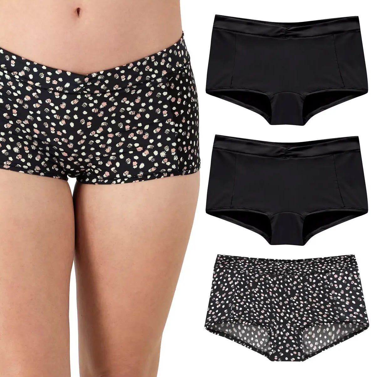 Three pairs of women's boyshort-style underwear in black and black with pink floral patterns.