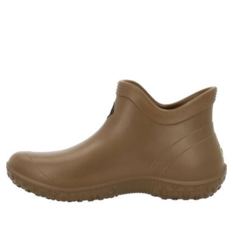 The Muckster Lite EVA Ankle Boot is a brown, slip-on footwear with a rounded toe and a slightly raised heel. Its design features a rugged sole for traction and an ankle-high cut for easy wear.