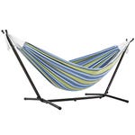 A striped double hammock with blue and green hues suspended on a black, freestanding metal stand.