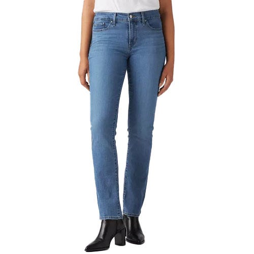 A person is wearing blue straight-leg jeans and black heeled ankle boots.