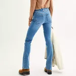 A person is wearing light blue bootcut jeans with a classic five-pocket design, visible through a rear view.