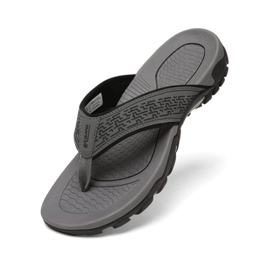 A single black flip-flop sandal with a patterned footbed and strap.