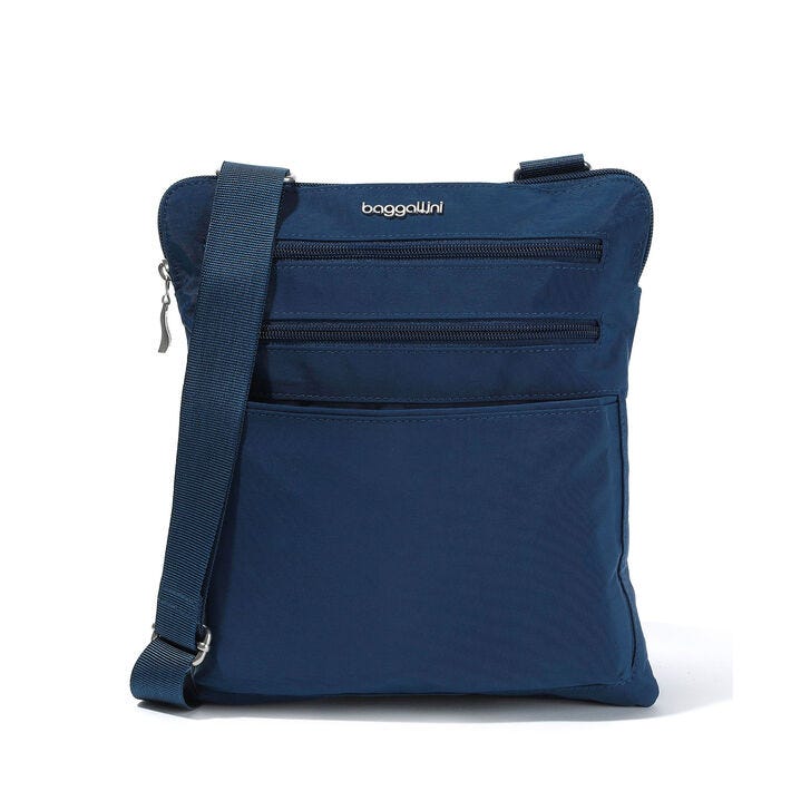 A navy blue crossbody bag with multiple zippered compartments.