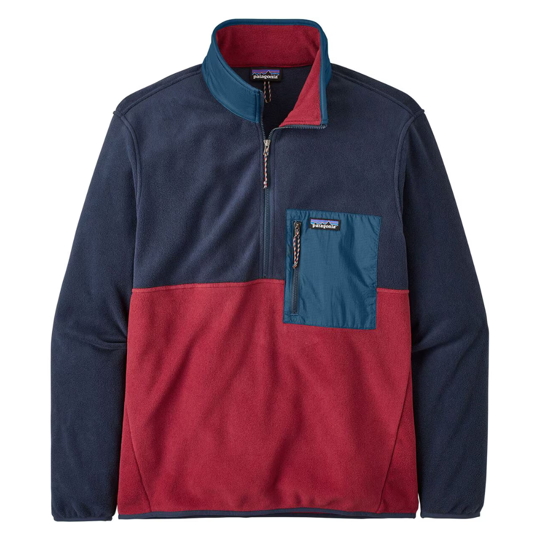 Color-blocked fleece jacket with chest pocket and zipper closure.