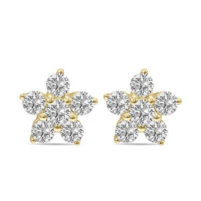 A pair of gold stud earrings with a cluster of round diamonds forming a flower shape.