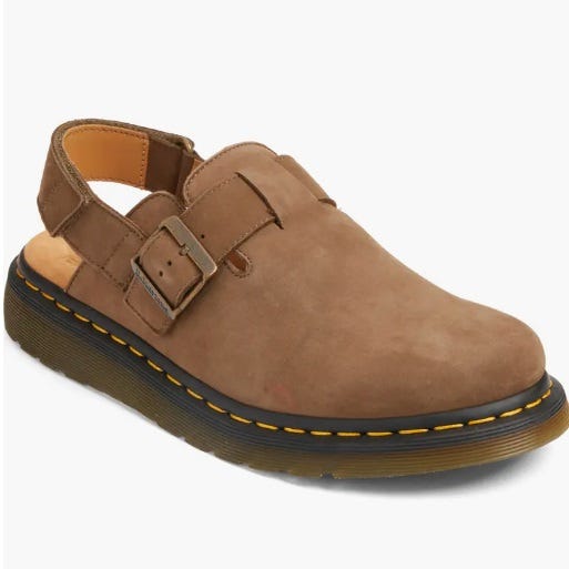 Brown monk strap casual shoe with a buckle and contrast stitching.