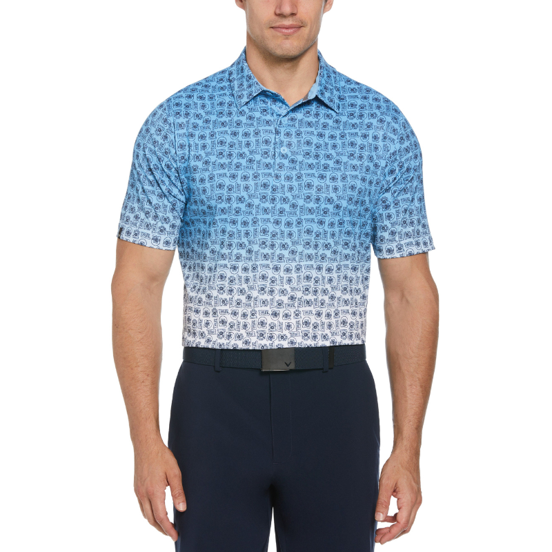 Blue and white short-sleeve golf polo with an ombre effect from top to bottom features a retro tech pattern. The collar is classic, and the fit appears tailored, paired with dark pants.