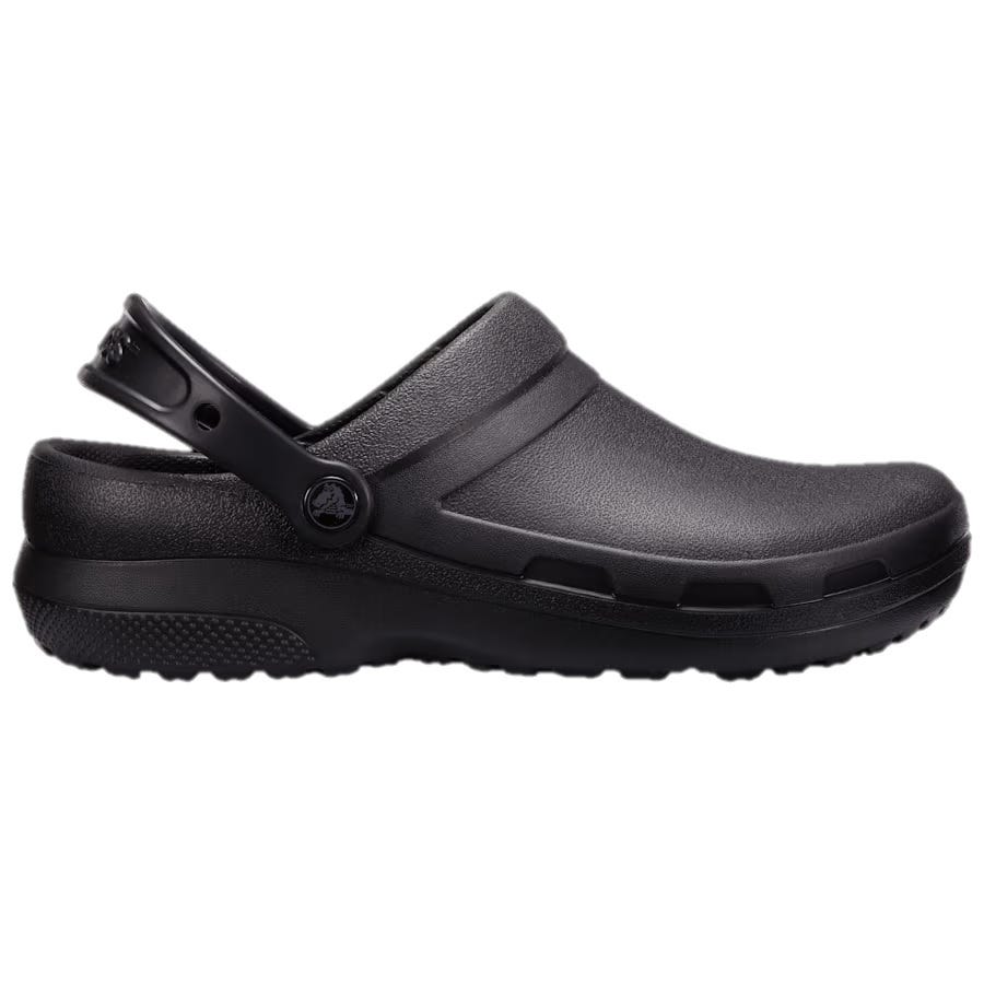 A black clog-style shoe with a strap around the heel, featuring ventilation ports along the sides and a textured sole for grip.