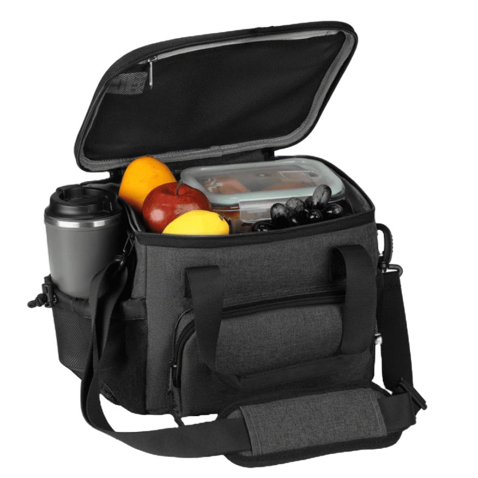 A gray insulated cooler bag with a 12-liter capacity, featuring a shoulder strap and external pockets. The open compartment contains a travel mug, various fruits, and a food container.